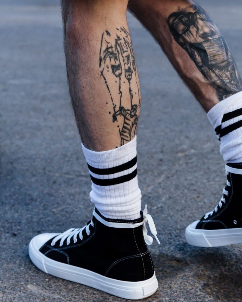 Leg placement tattoo for men
