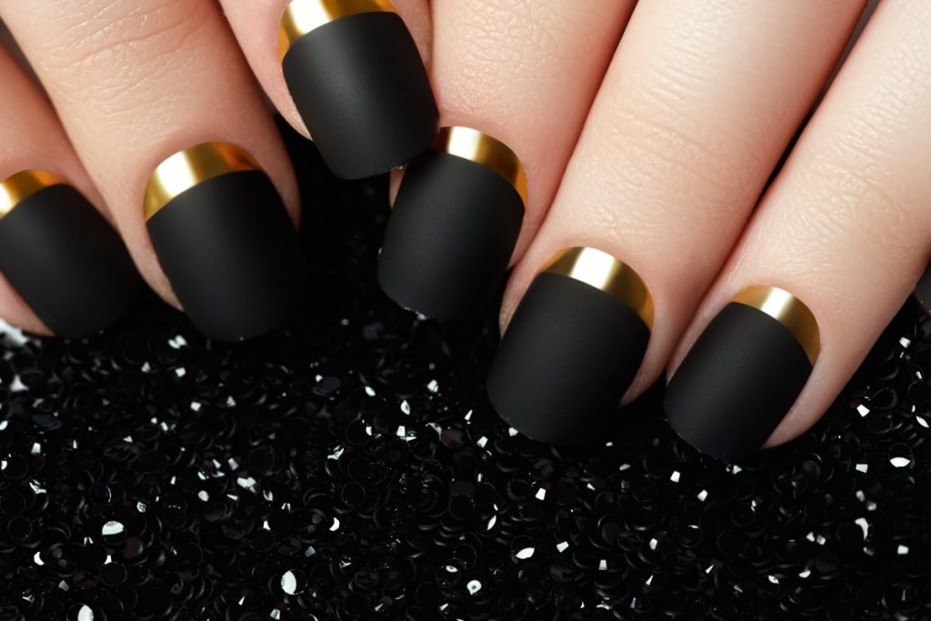obscure beauty treatments black and gold nails